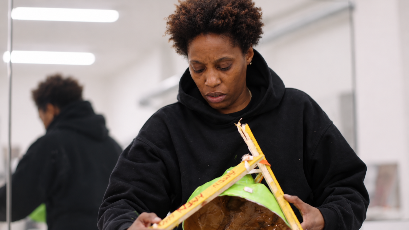 Genesis Tramaine working on an artwork at the Braswell Arts Center